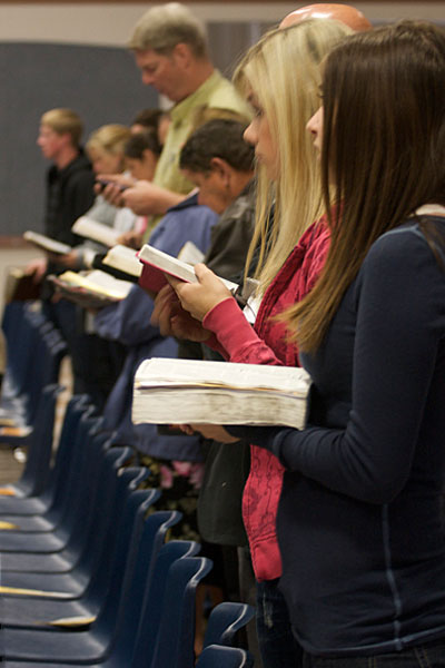 Standing with Bible in hand